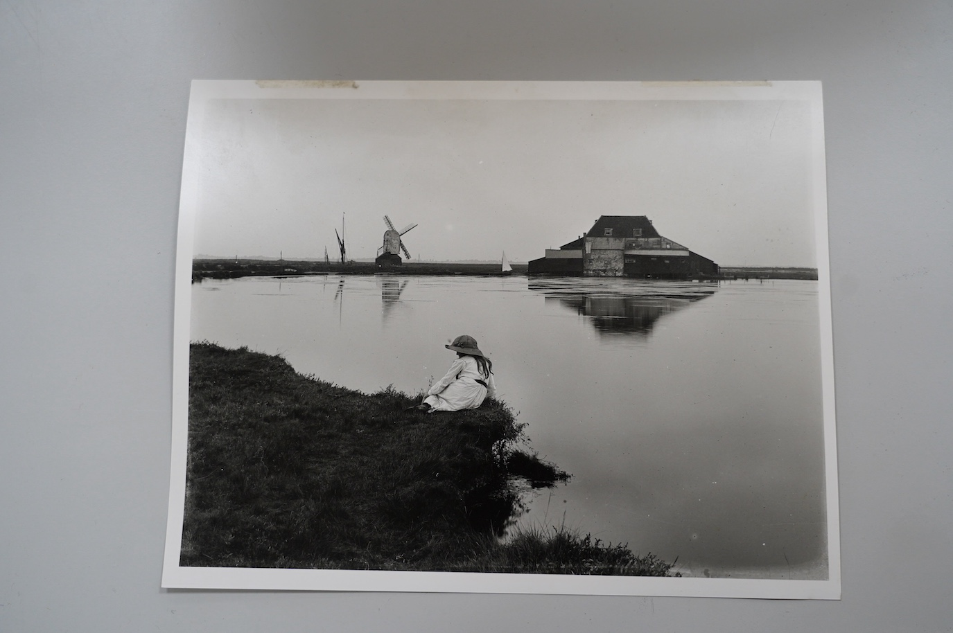 Attributed to Edward King RA (1863-1930), oil on canvas, Study of Tide Mill and windmill at Walton on the Naze, together with English Heritage National Monuments Record photograph of the scene, oil 44.5 x 90.5cm. Conditi